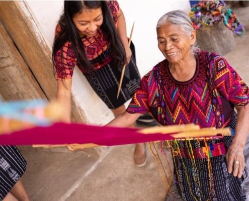 Guatemalan women using a backstrap loom used to make gorgeous textiles like the one below.