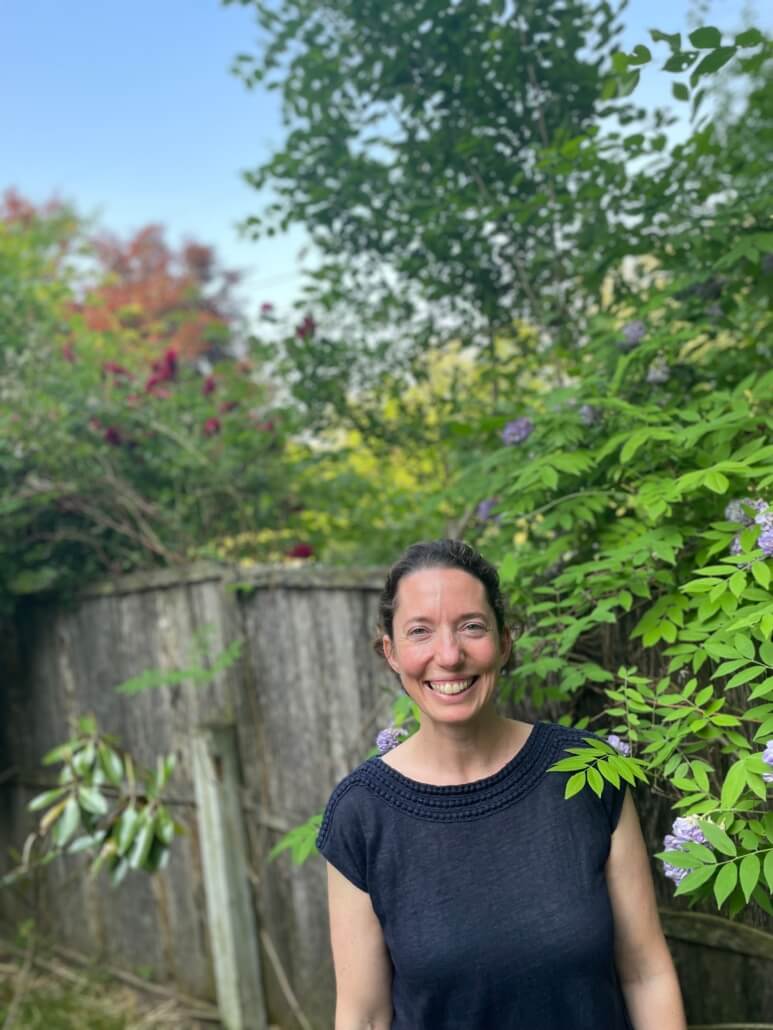 Photo of Deborah in her garden.