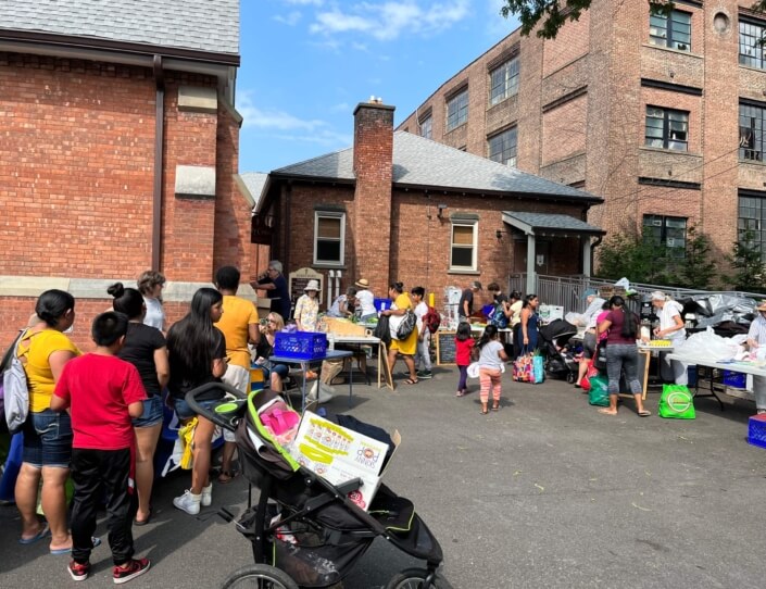 People lining up for food at church in Kingston.