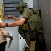 A federal immigration officer at U.S. immigration court, NYC, July 2025